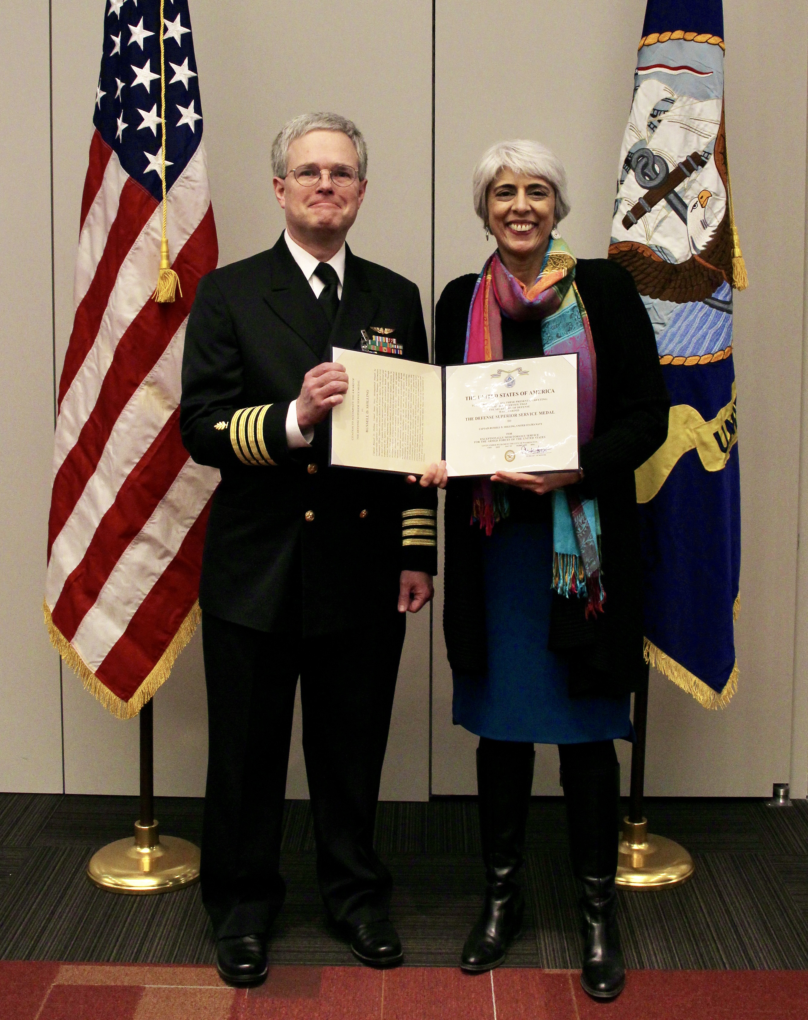 Russell Shilling at a Navy retirement ceremony with DARPA Director Arati Prabhakar.